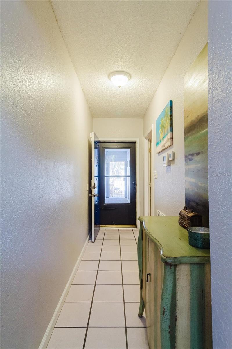 Foyer with Title Floors View of the Front Door