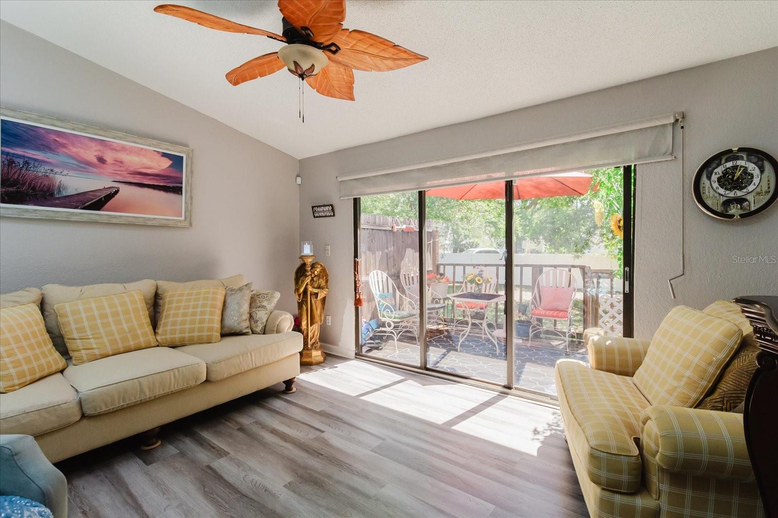 Living Room With Luxury Vinyl Floors & Balcony Access