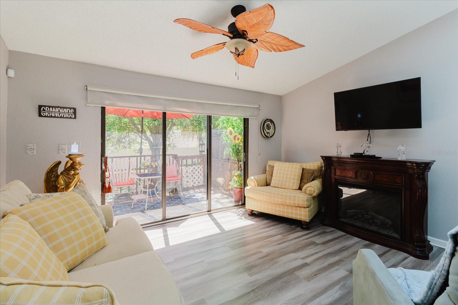 Living Room With Luxury Vinyl Floors & Balcony Access