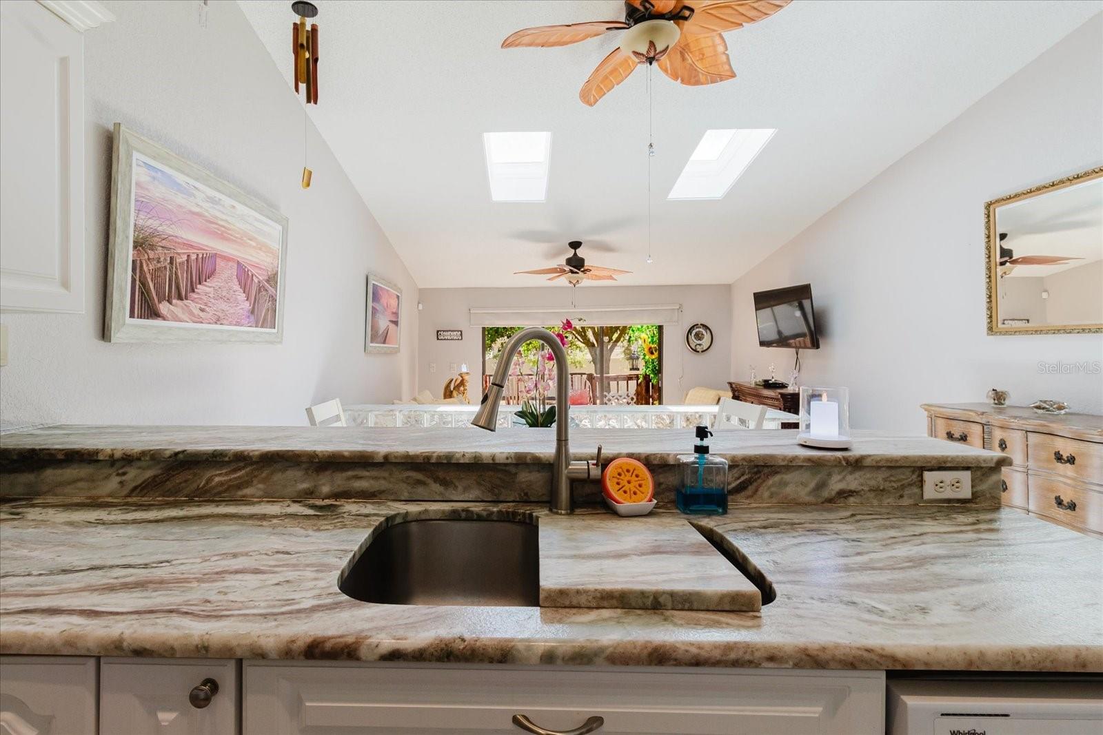 Light and Bright Open Concept Main Floor. Kitchen and Dining Area Have Tile Floors. Breakfast Bar Seats 3 Comfortably.