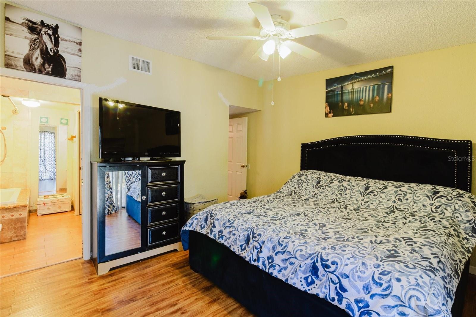 Primary Bedroom Fits A King Size Bed. Luxury Vinyl Flooring with Access to the Primary Bath