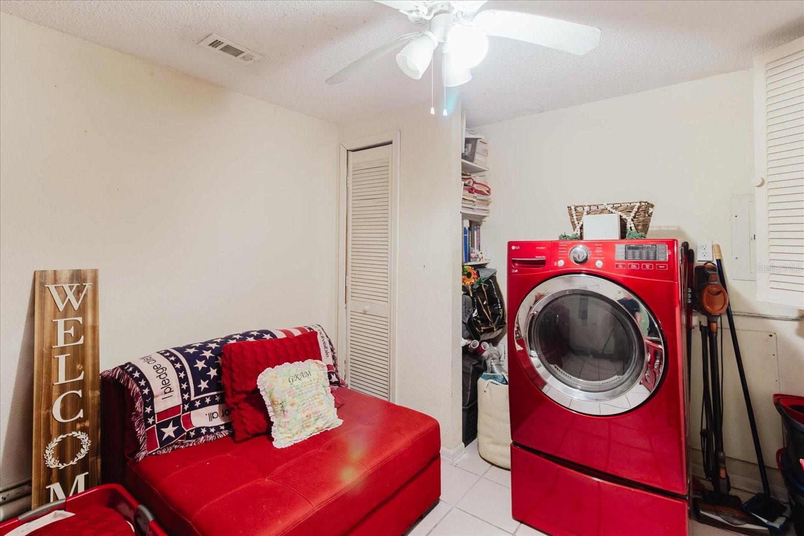 Main Floor Laundry With Title Floors, Right Off the Garage