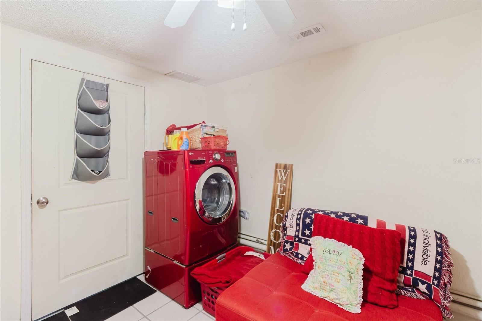 Main Floor Laundry With Title Floors, Right Off the Garage