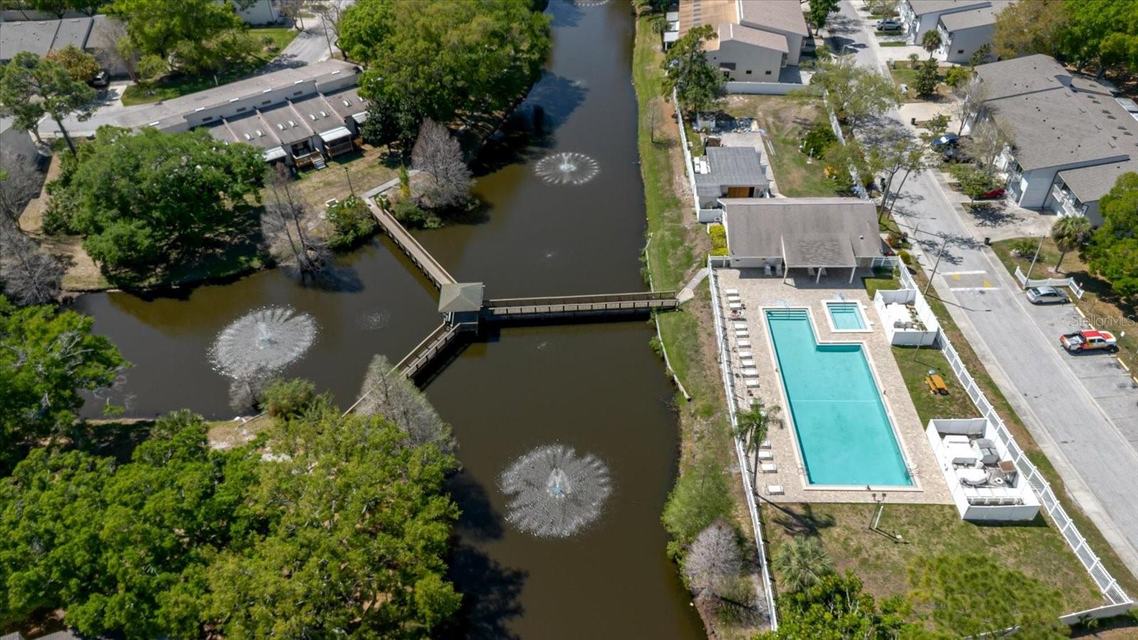 Aerial View of the Canal, the Community Pool, and the Clubhouse
