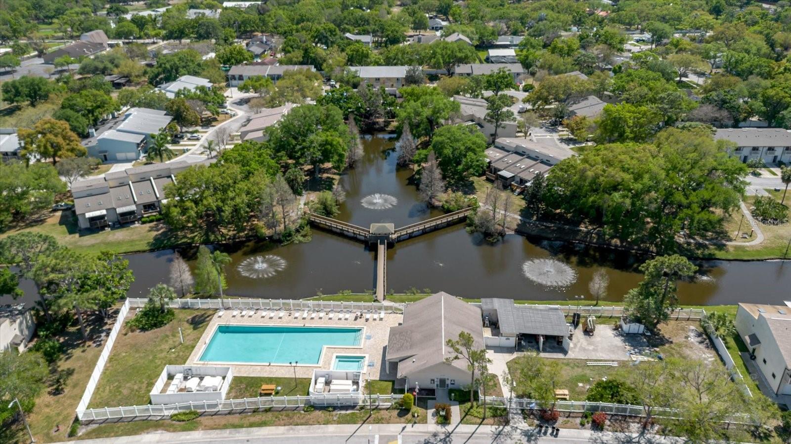 Aerial View of the Canal, the Community Pool, and the Clubhouse
