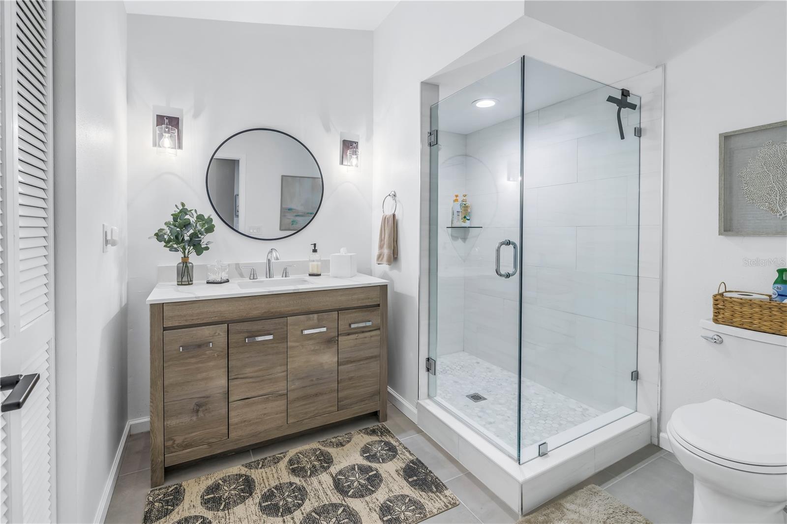 2nd Full Bath Features all new Shower, Furniture Vanity, Toilet, Fixtures and Seamless Glass