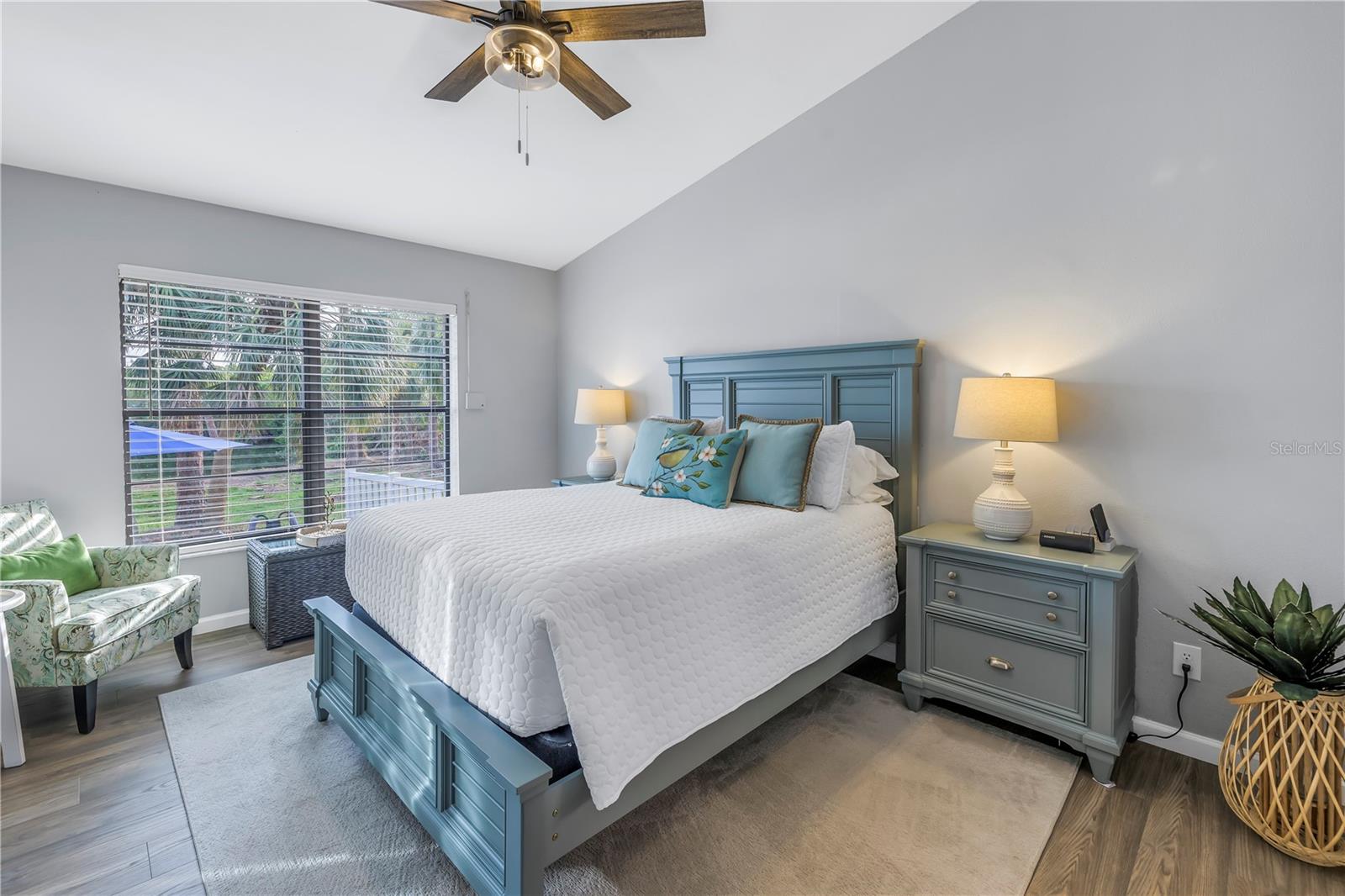 Primary Bedroom with Views to the Preserve and Waterfront.  High vaulted ceilings in this room too.