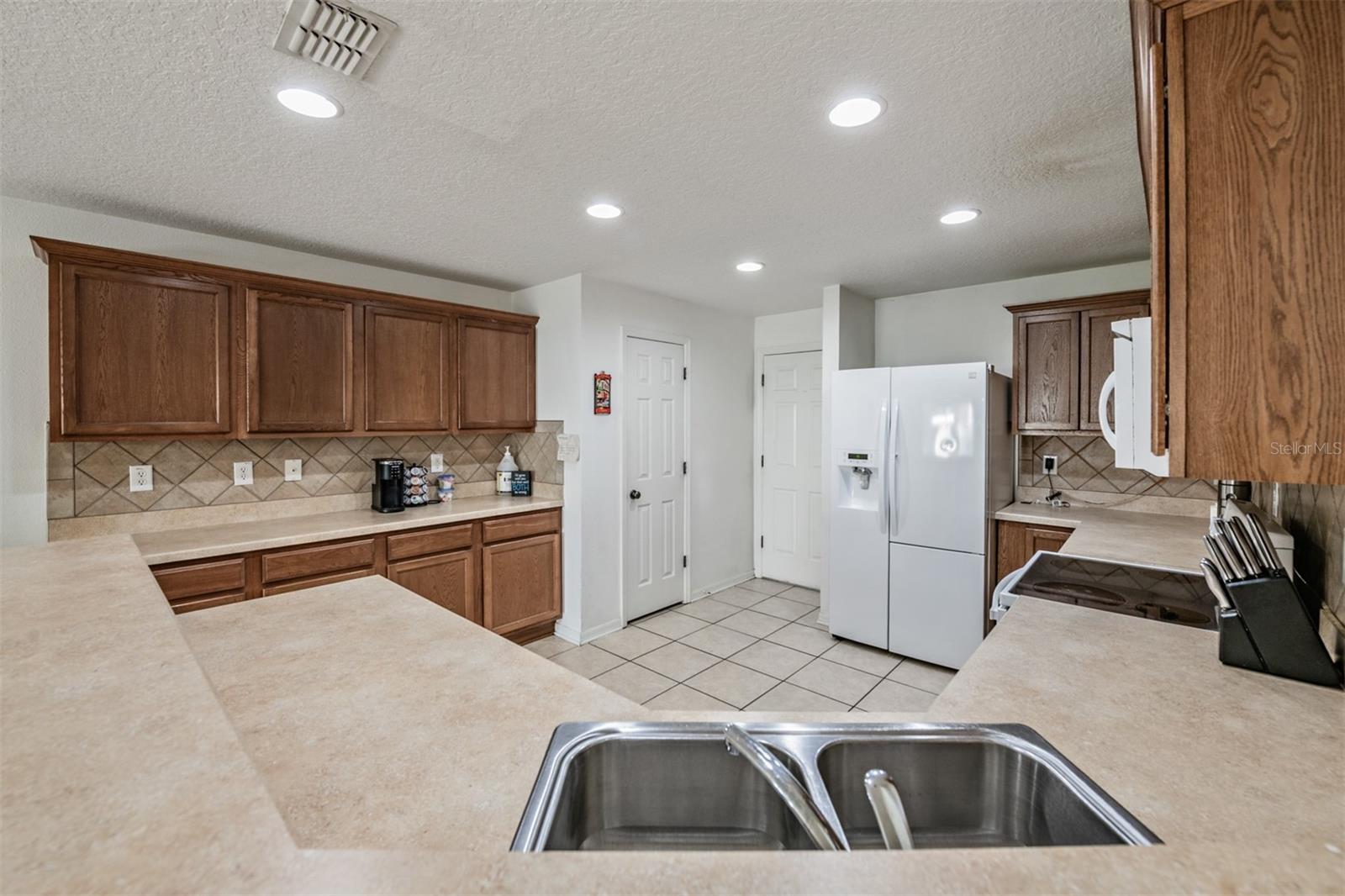 arge and Open Kitchen to the Family Room and the backyard view.