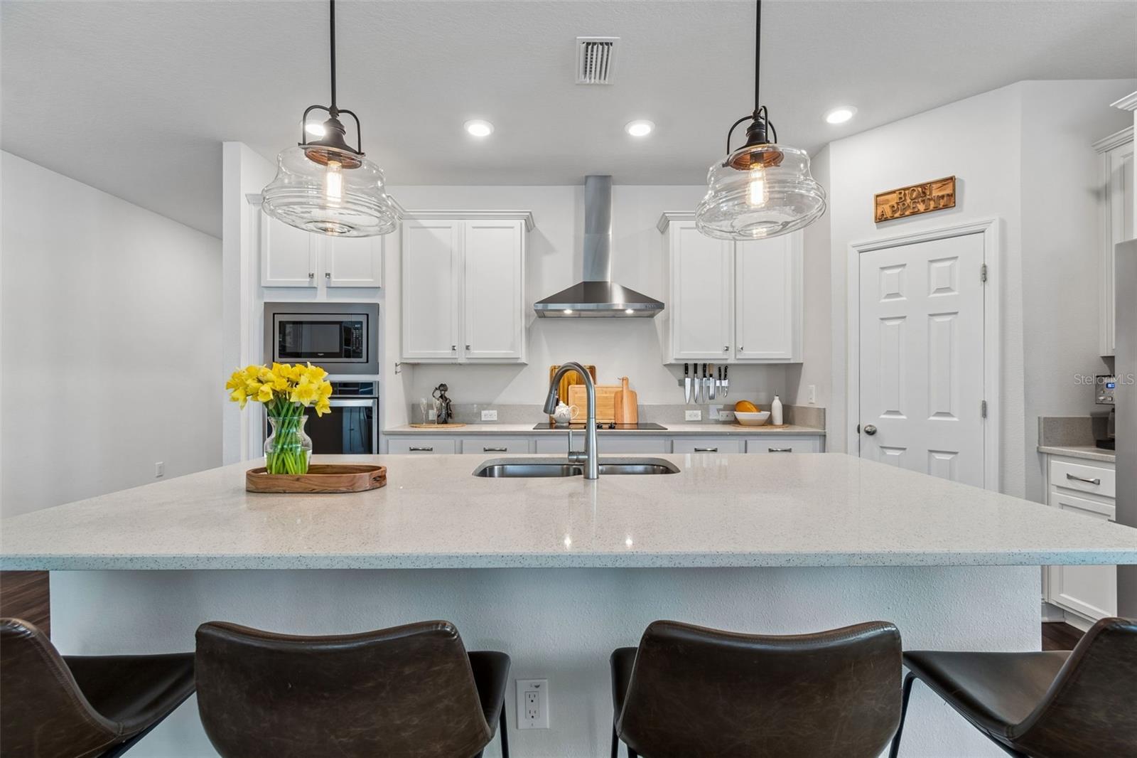 Kitchen with Quartz Countertops & Stainless Steel Appliances