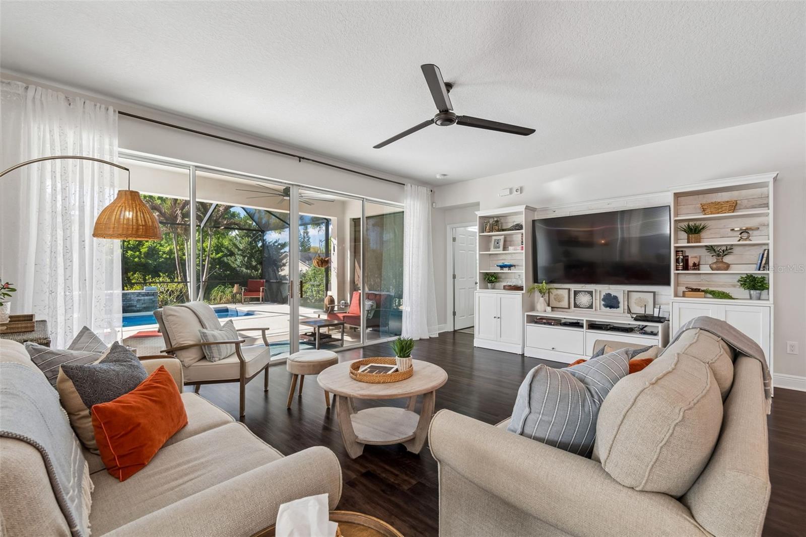 Family Room with sliders opening to pool and lanai