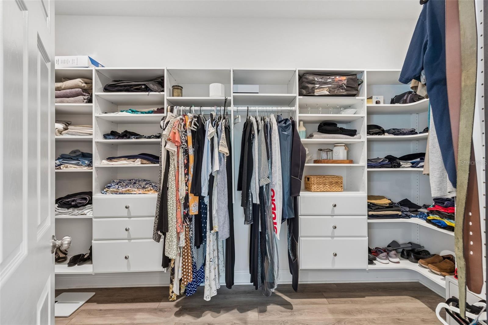 Primary Walk-In Closet with custom shelving