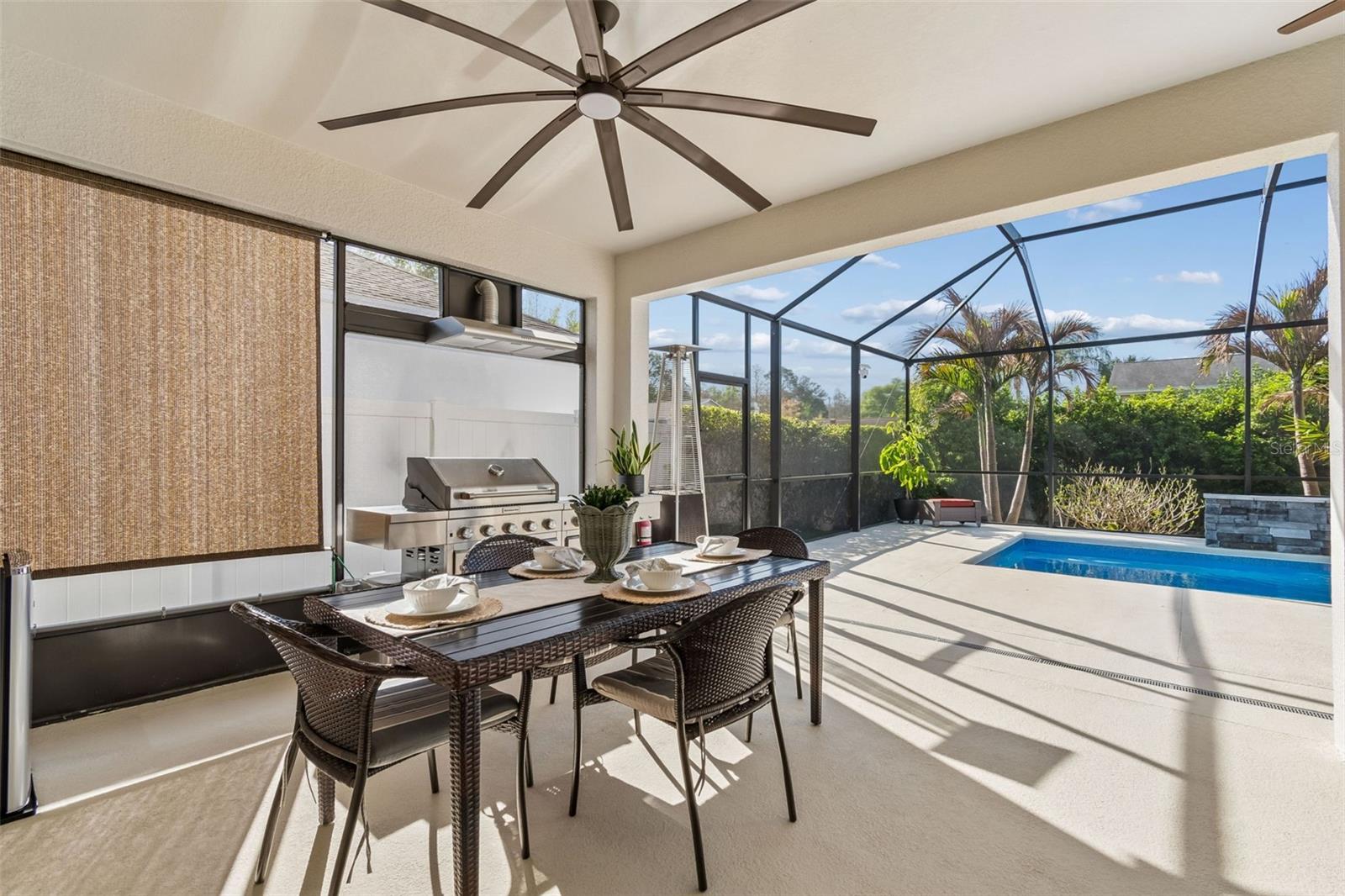 Outdoor Kitchen and Dining overlooking pool