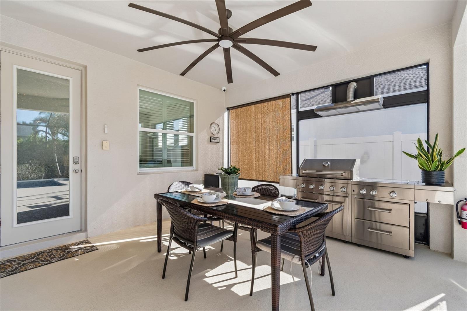 Covered Lanai with outdoor kitchen and dining