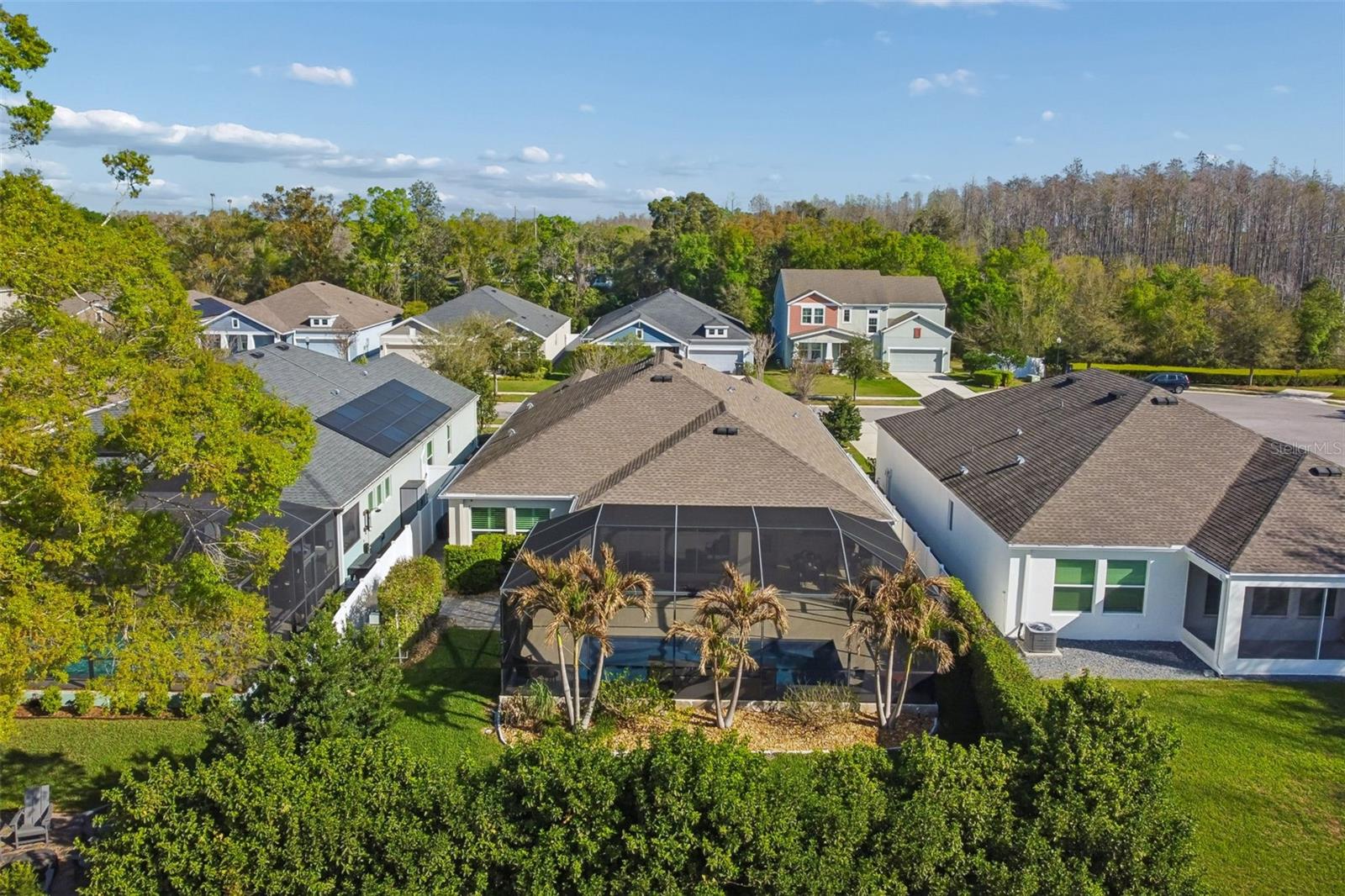 Aerial view of home and fenced backyard