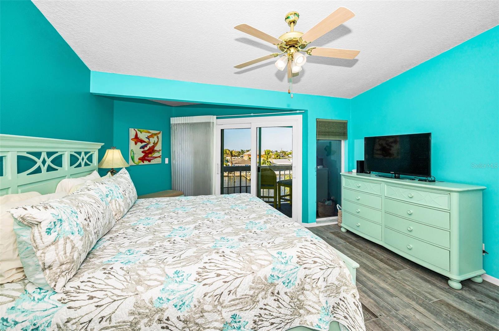 Primary bedroom with decorative barn door to the bathroom