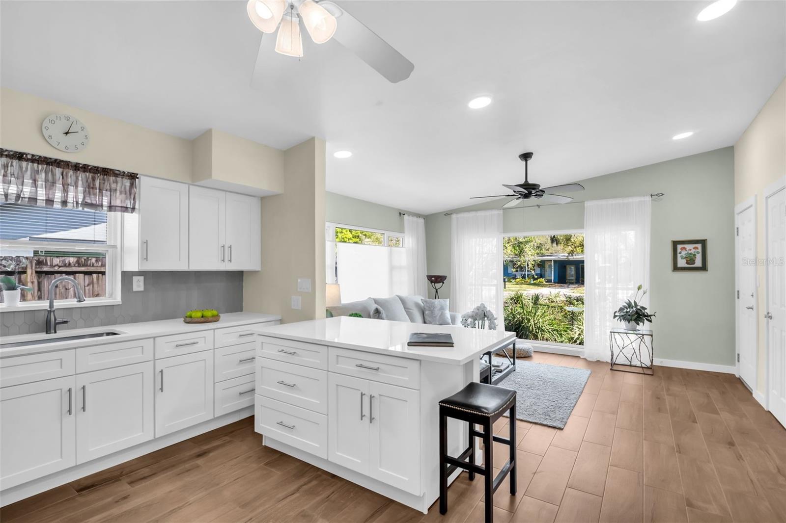 Recessed lighting and bar top seating for casual dining~