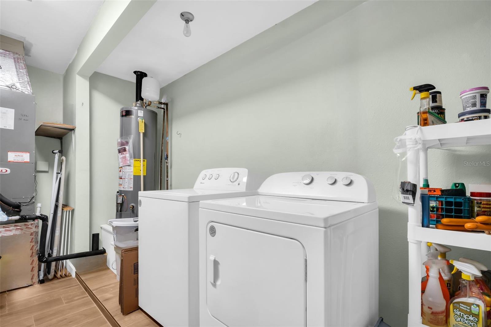 Oversized indoor laundry with plenty of room for additional storage~