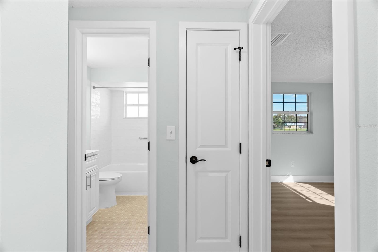 Hallway Linen Closet between Secondary Bedroom and Bathroom