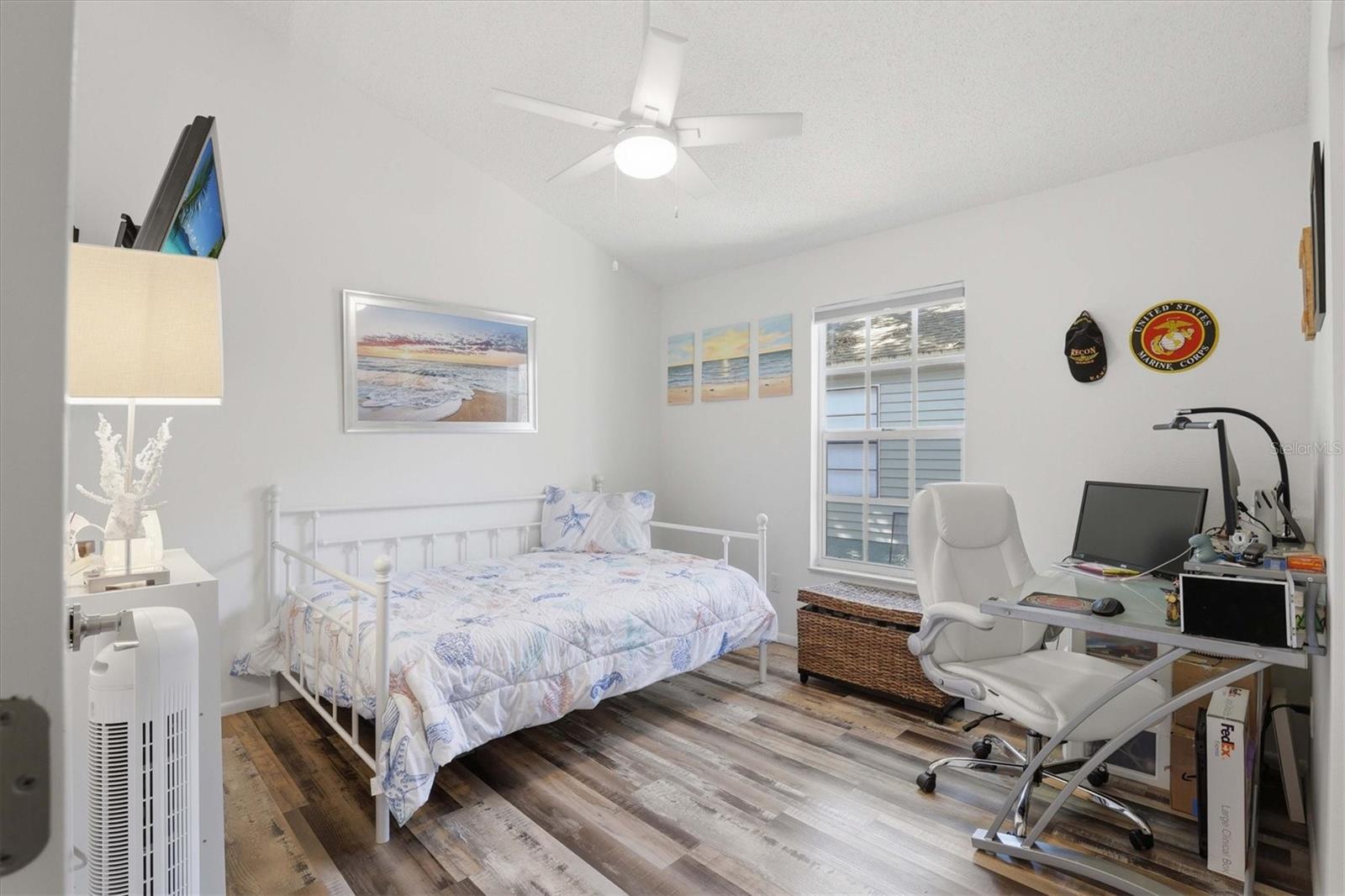 Bright and spacious second bedroom, perfect for guests or a home office.