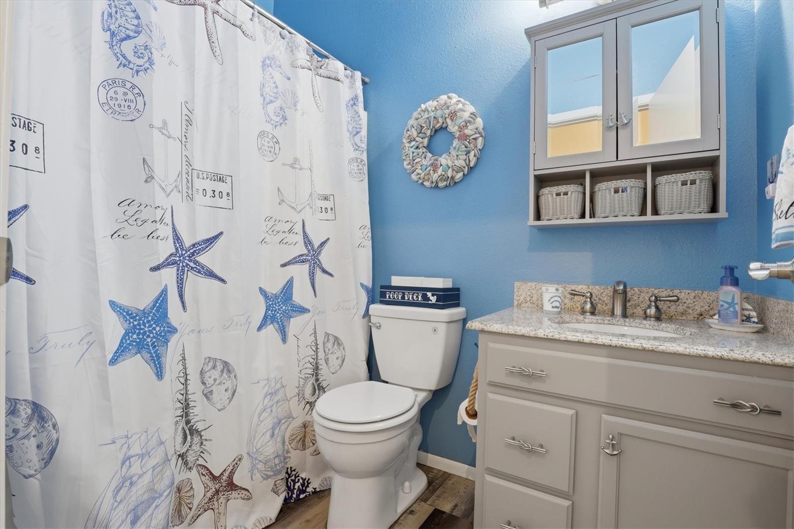 Second full bathroom with tub/shower combination, perfectly positioned for the split bedroom arrangement.