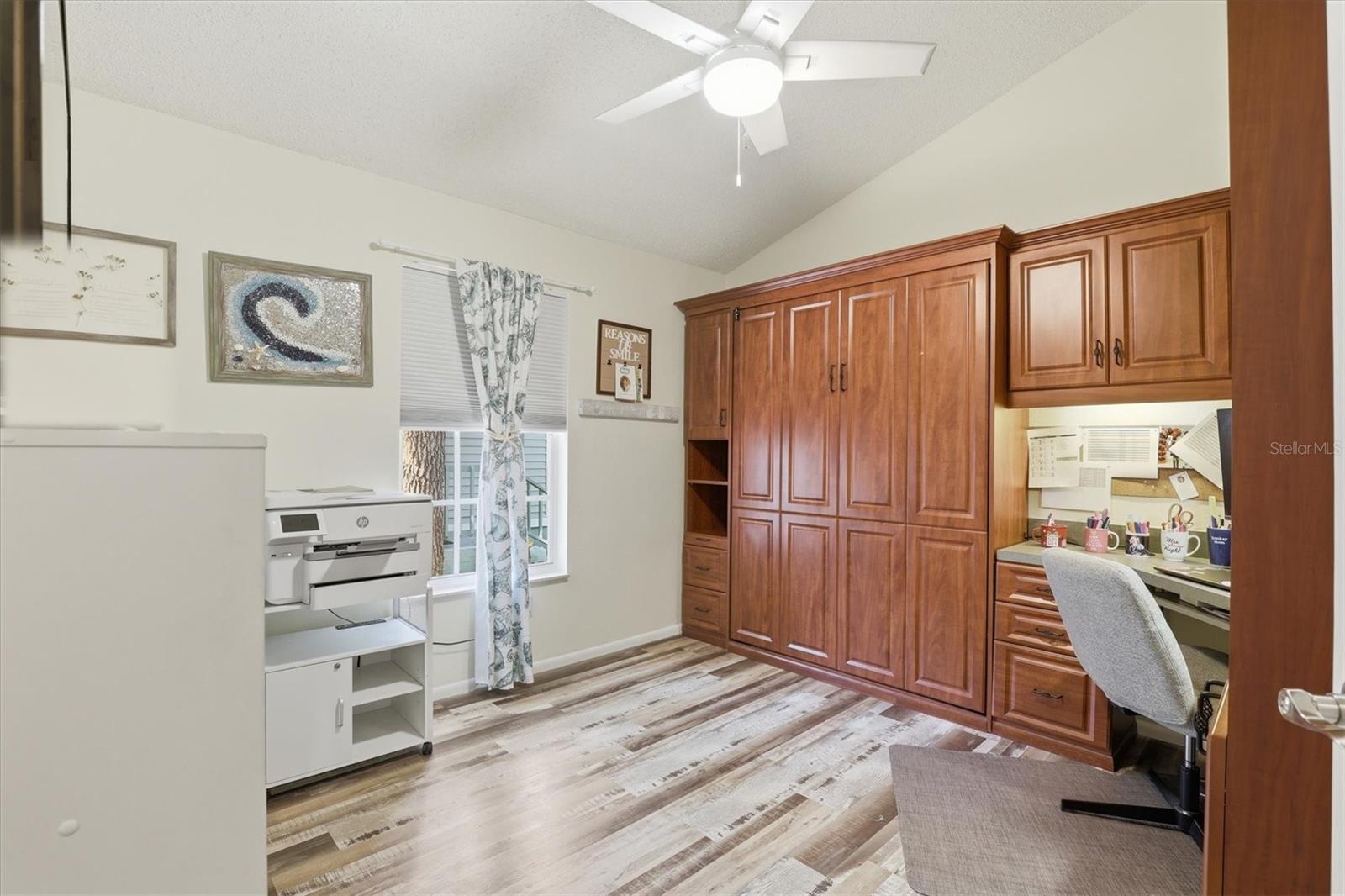 Versatile third bedroom/office with Murphy bed, maximizing functionality and space.