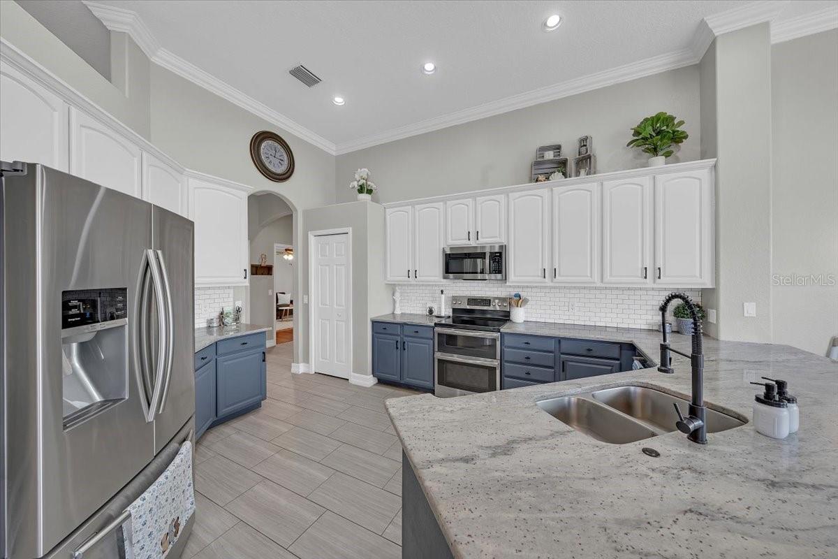 Expansive granite countertops ideal for meal prep and entertaining.