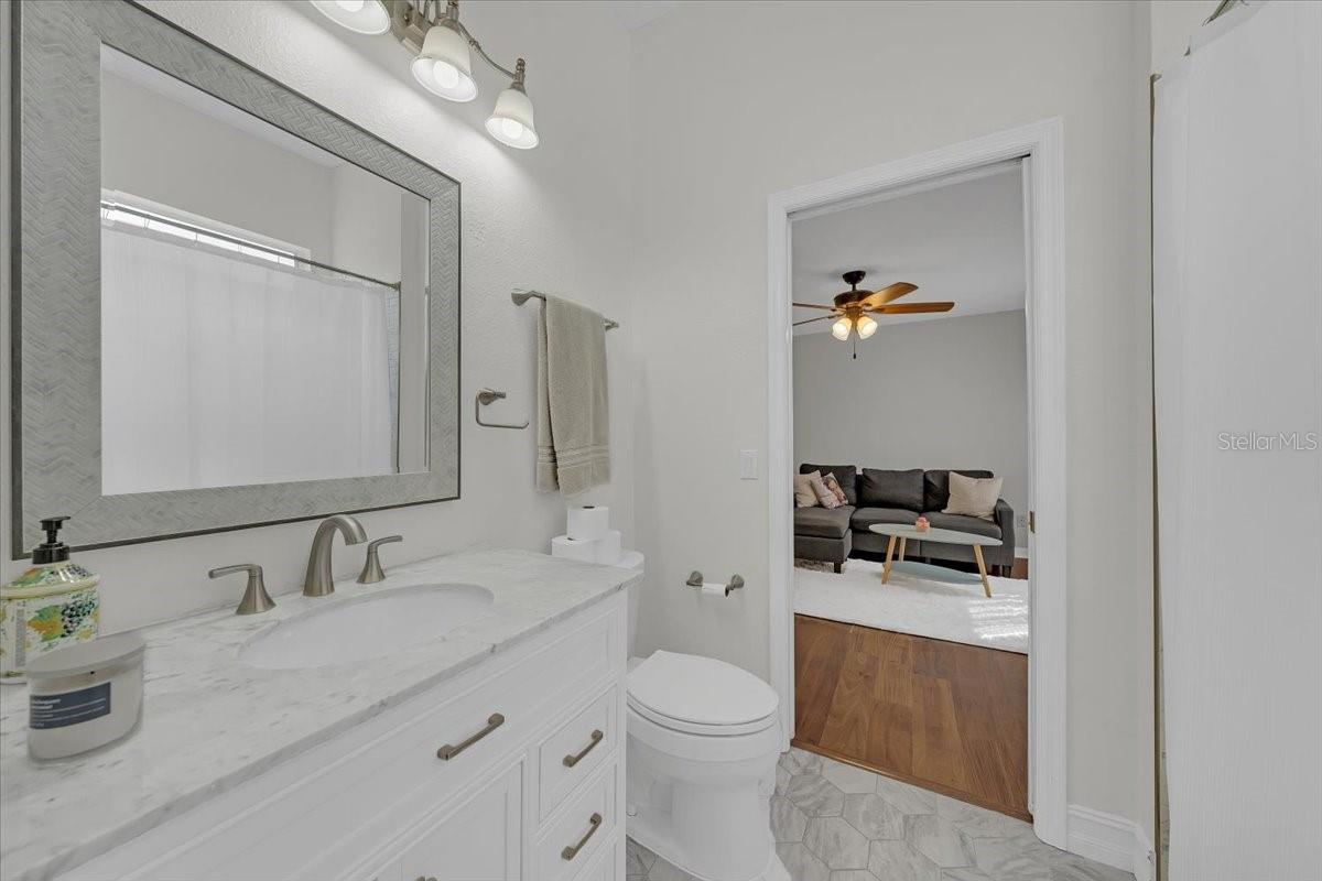 Shared bathroom between two secondary bedrooms.