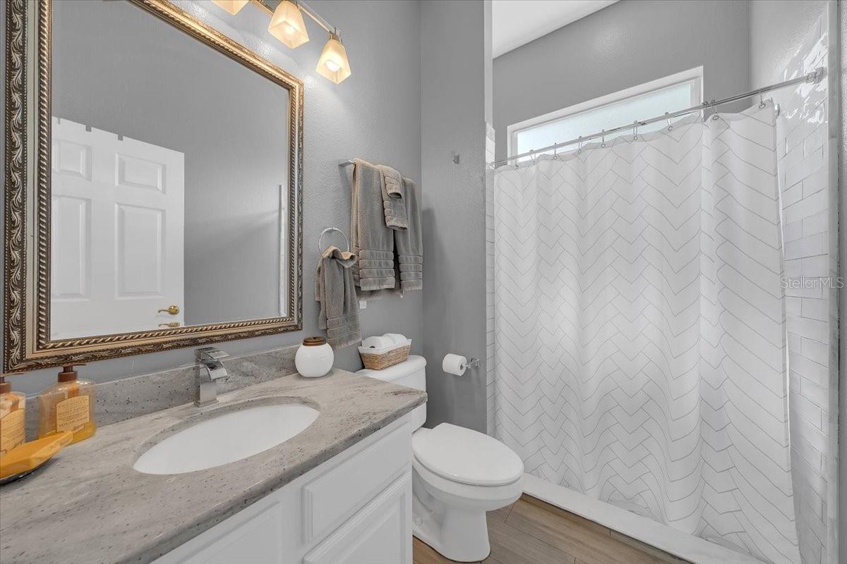 Full bathroom located in the upstairs bonus area.