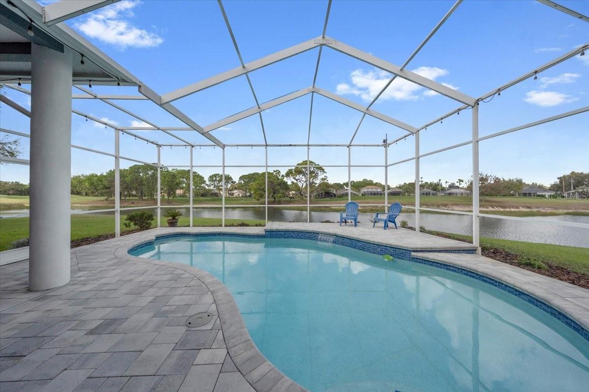 Private pool overlooking the peaceful golf course and water views.
