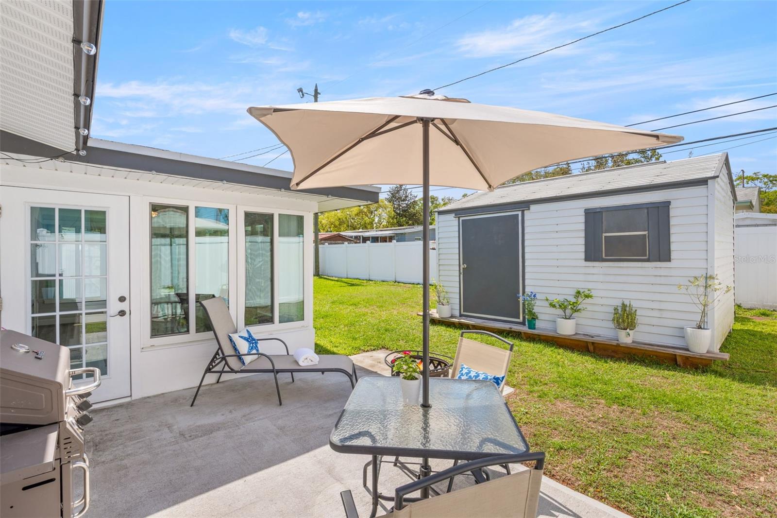 Back patio for lounging & grilling with friends.