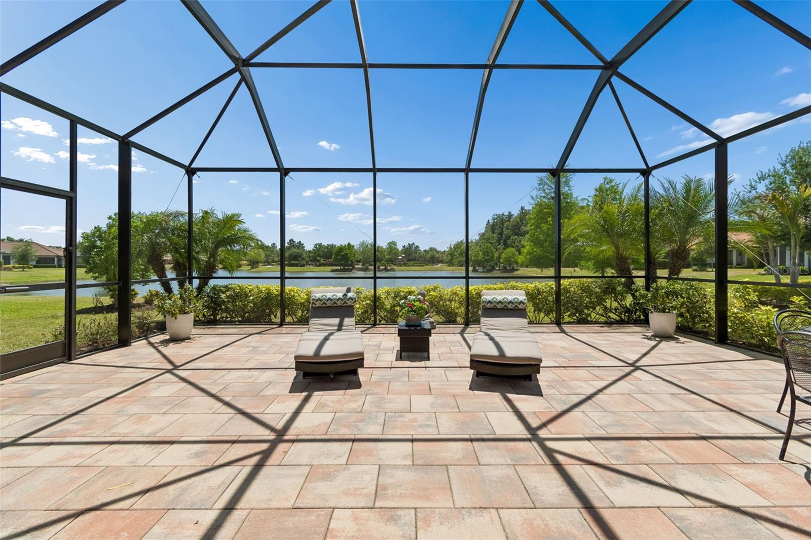 Premium Pond Views. Extended screened lanai added in 2020 creates exceptional indoor-outdoor living.