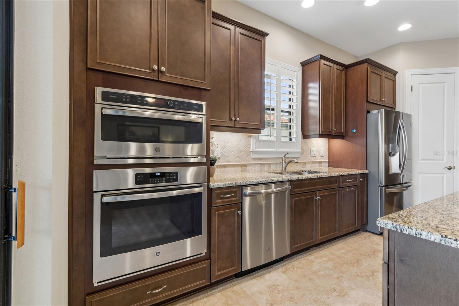 Built-in oven with microwave above and generous counter space for meal prep and entertaining.