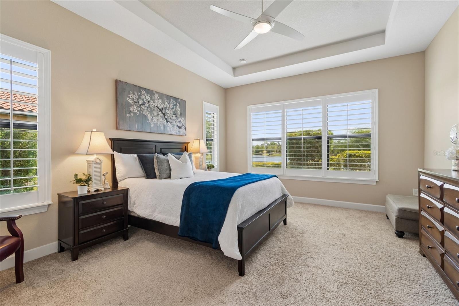 Primary suite positioned to capture tranquil pond views with desirable southern exposure.