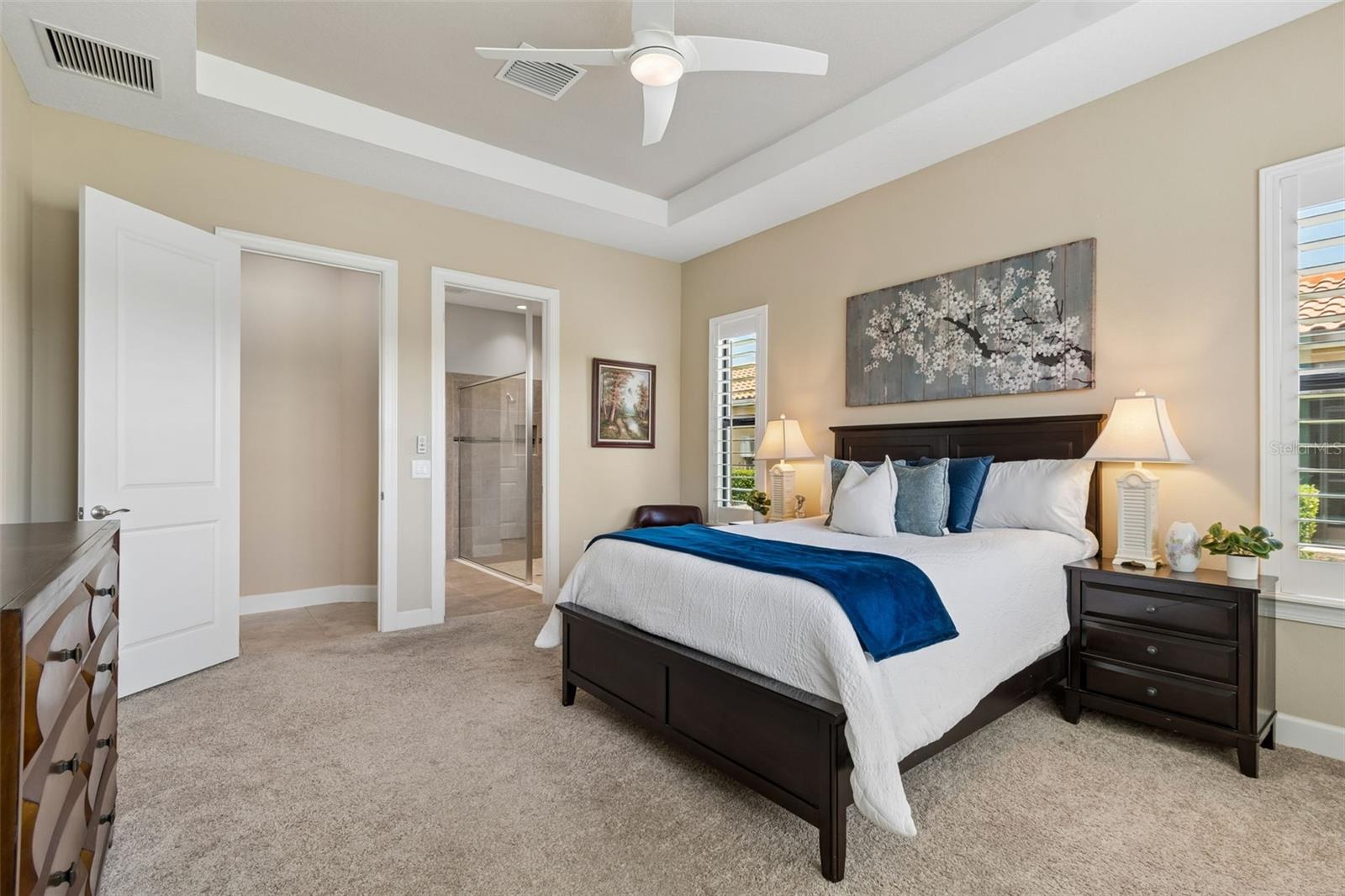 Step through to your spacious bathroom and master closet beyond! Plantation shutters throughout!