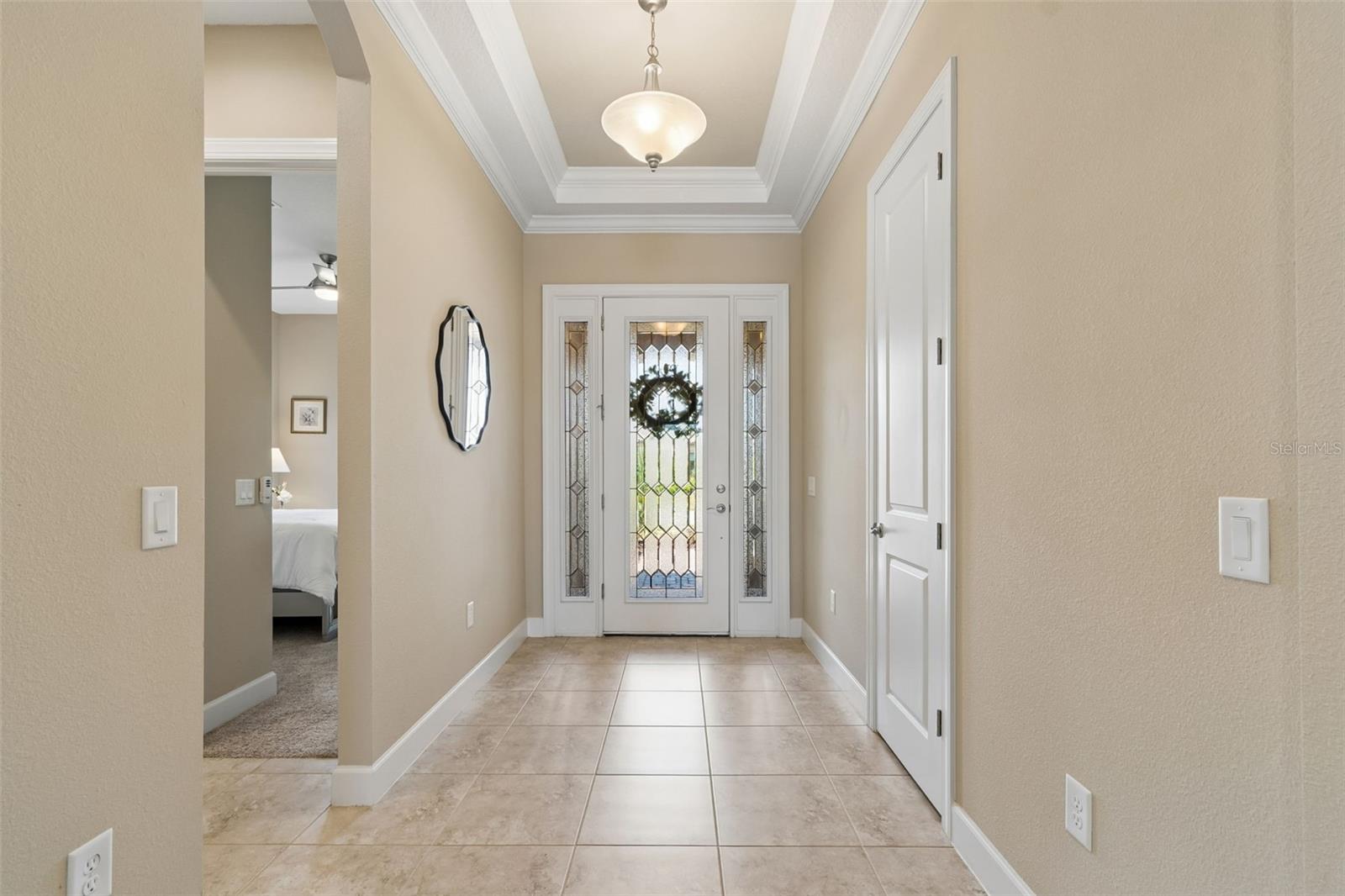 Steps from the main entrance is the front bedroom, complete with adjoining full bath in the hallway- perfect for visiting guests to use.