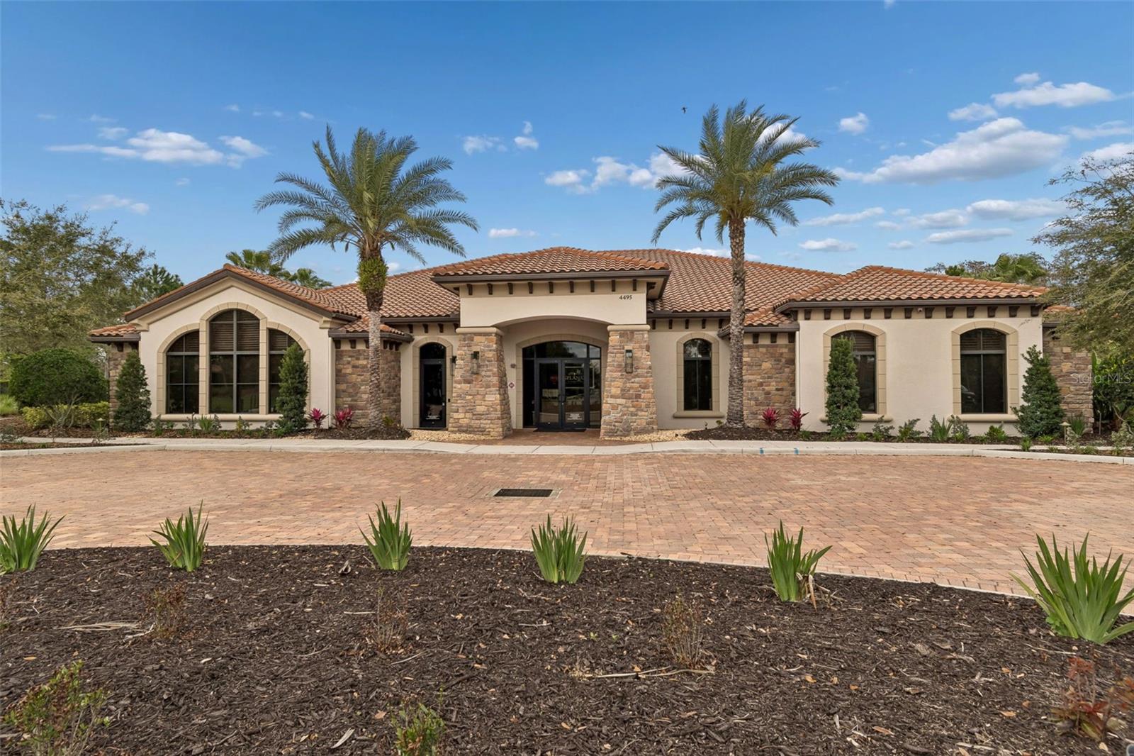 Resort-style pool, clubhouse, fitness center, tennis, pickleball, and an active social calendar.