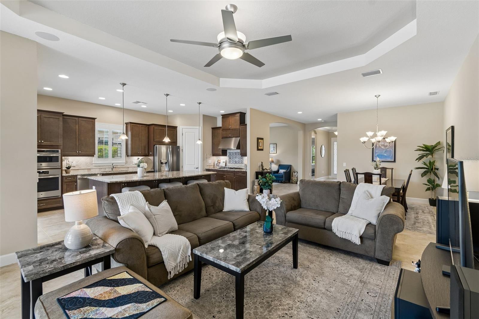 Main hallway leads to the open living space, dining, and upgraded gormet kitchen.