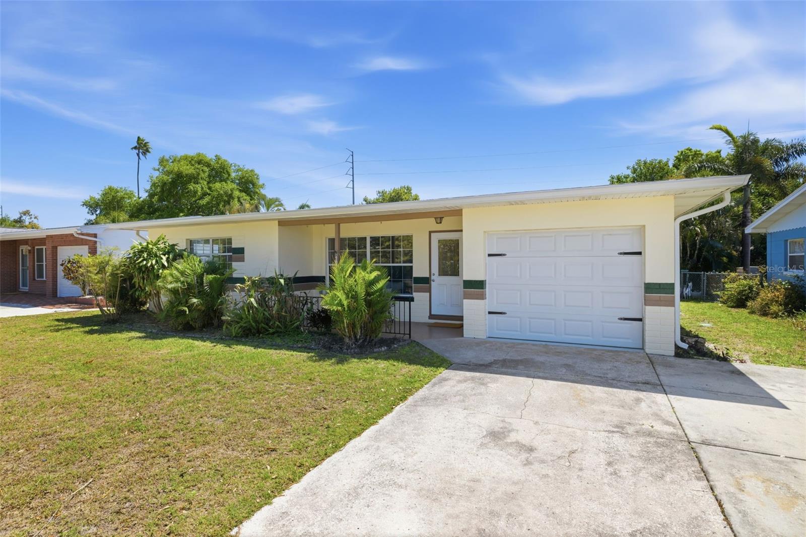 Welcome Home! Charming Mid-Century Modern home with classic curb appeal in a quiet Seminole neighborhood.