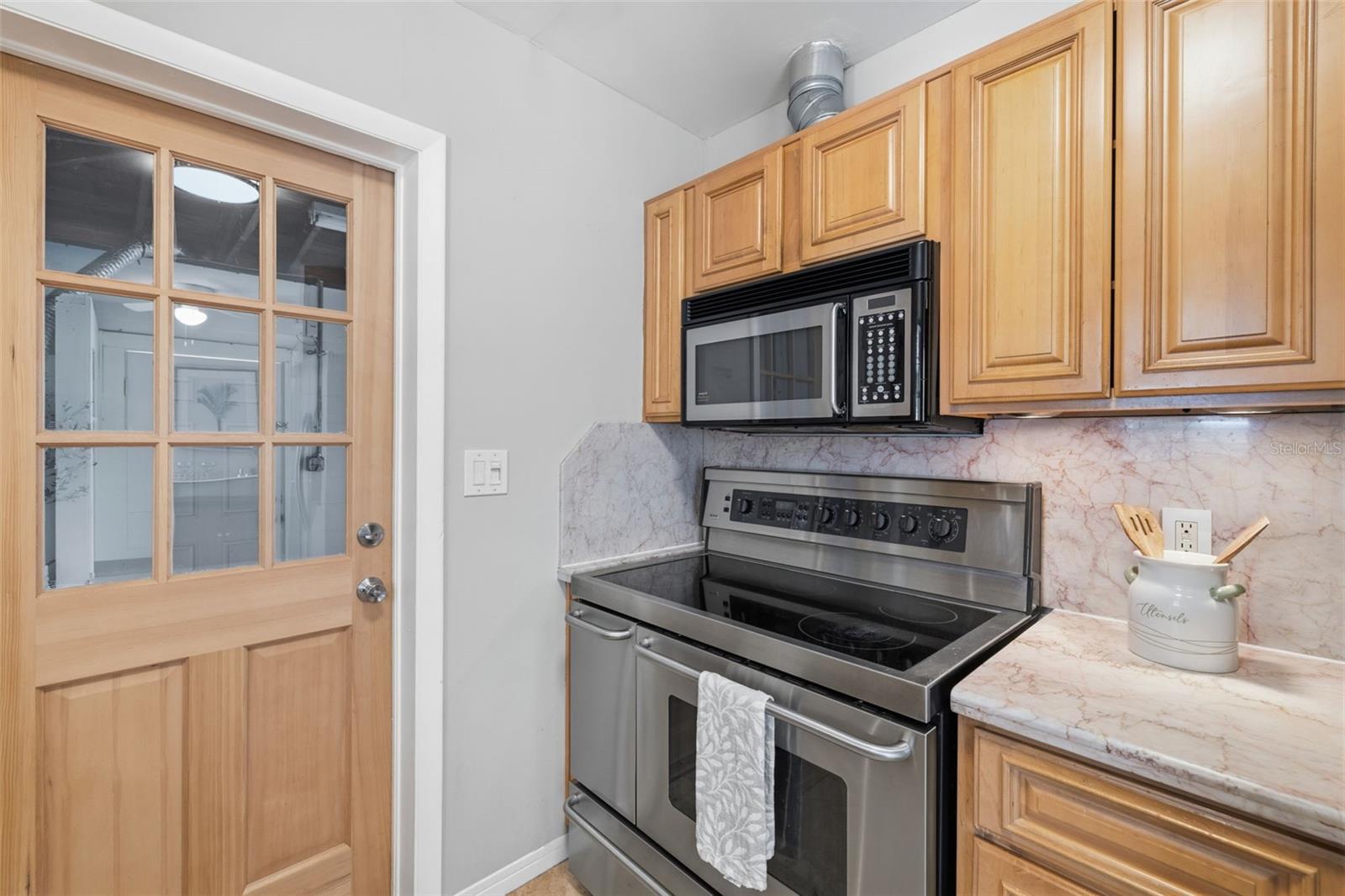 Range and cooking area with convenient layout.