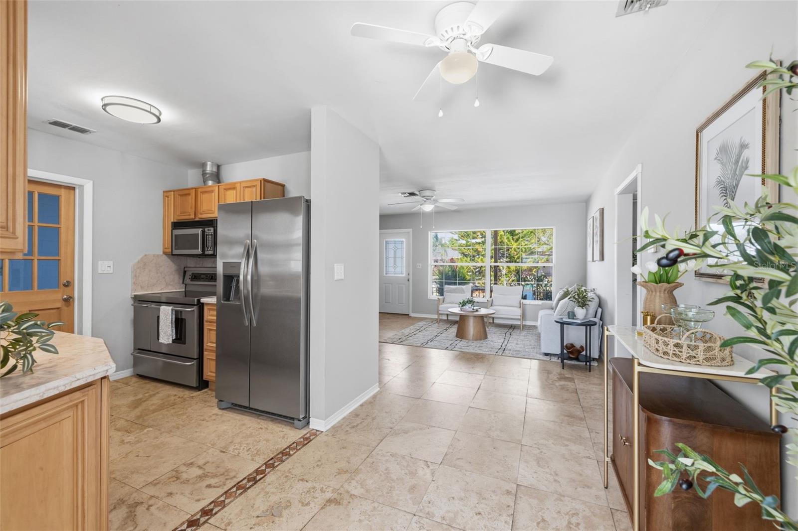Kitchen opens toward dining area and outdoor access.