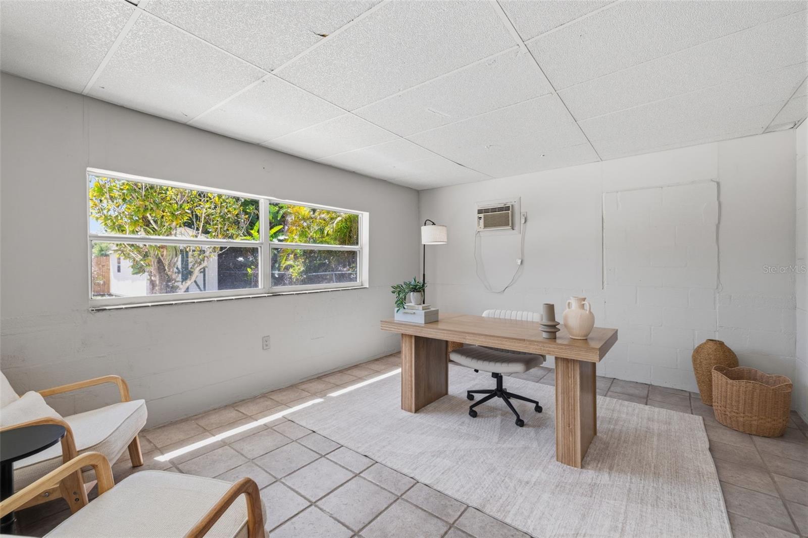 Versatile bonus room ideal for a home office, den, or additional living space.