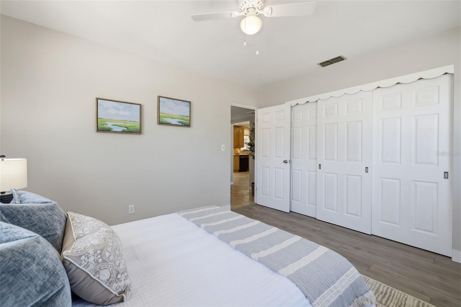 Primary bedroom with spacious closet storage.
