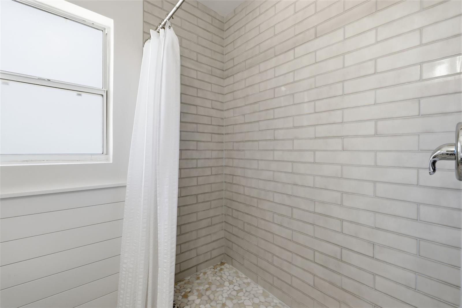 Shower area with clean, contemporary finishes.