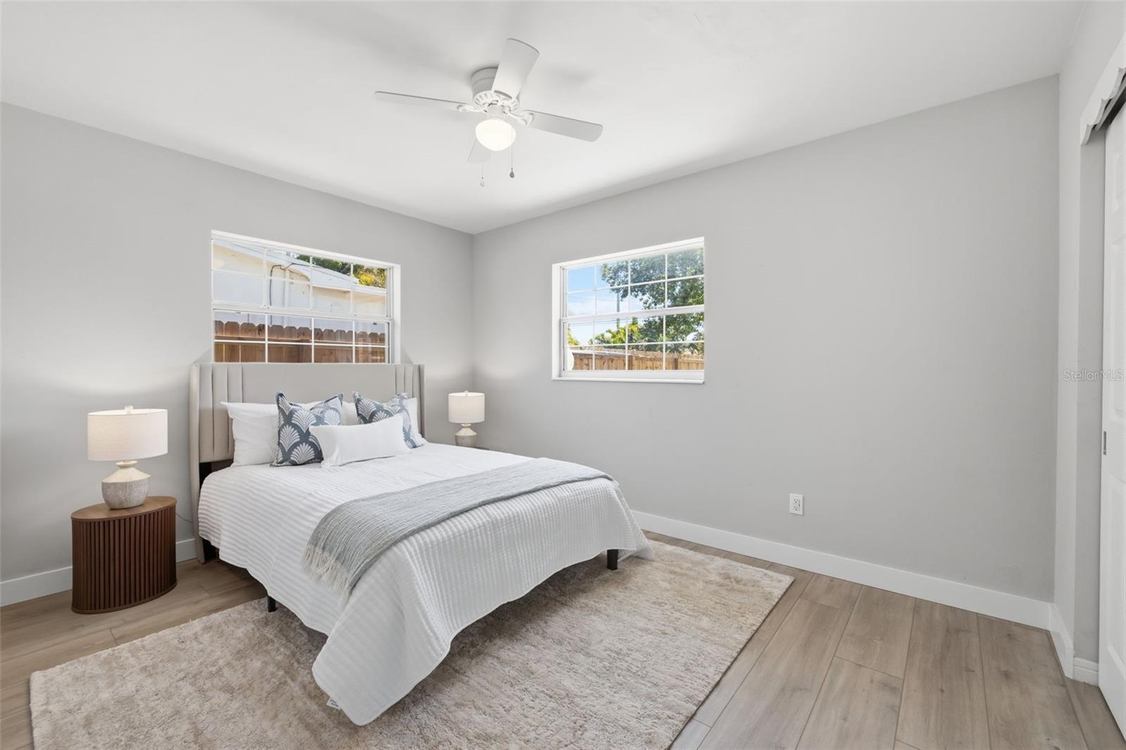 Secondary bedroom with durable flooring and natural light.