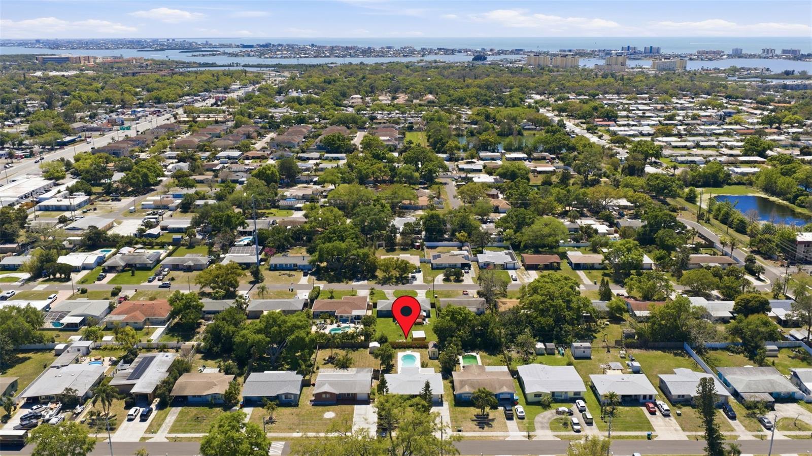 Aerial view of the surrounding Seminole neighborhood with the Intracoastal Waterway visible in the distance.