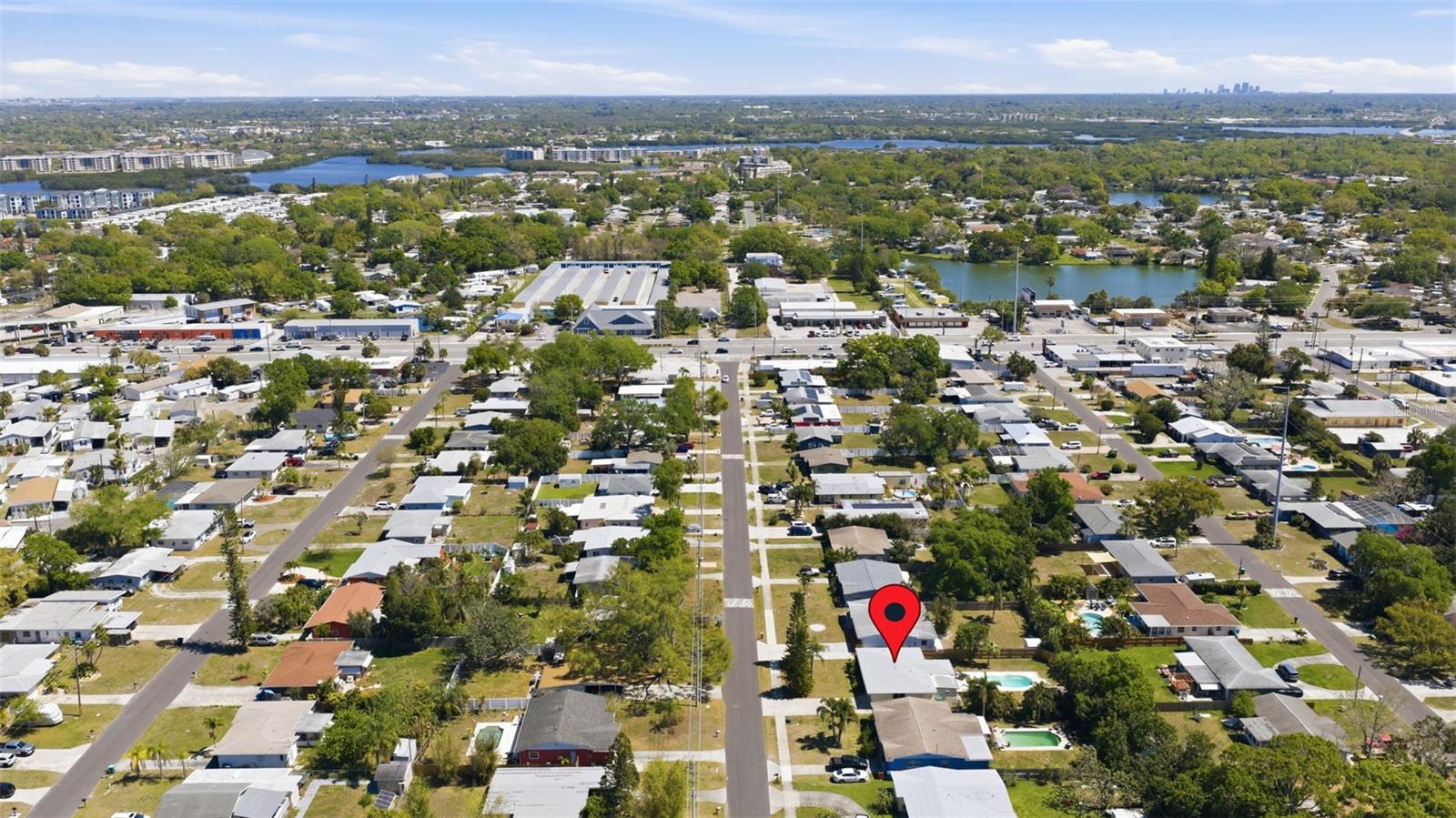 Aerial view showing proximity to major roads, local amenities, and nearby waterfront areas.