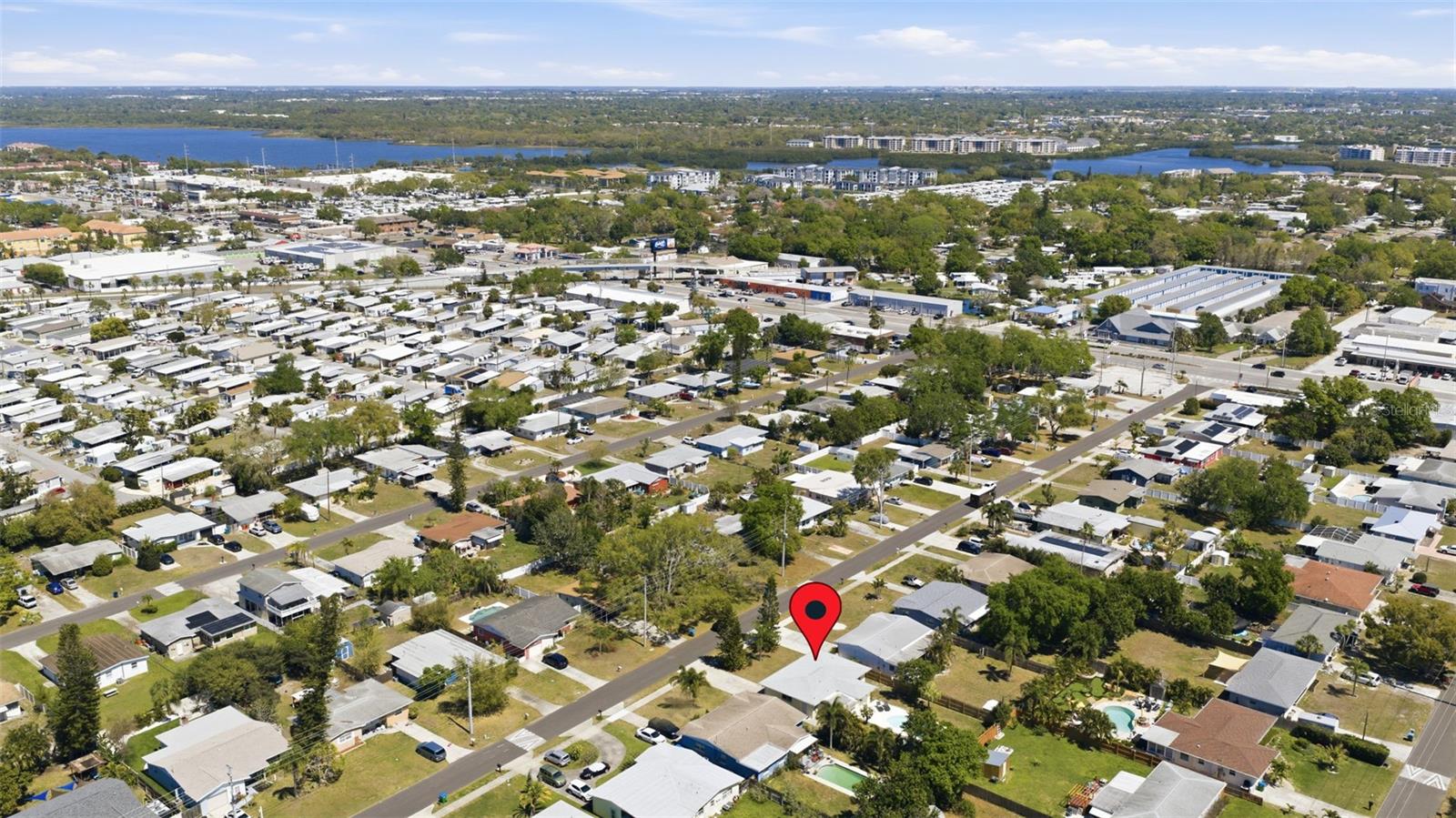 Neighborhood aerial with Intracoastal waters visible beyond the community.