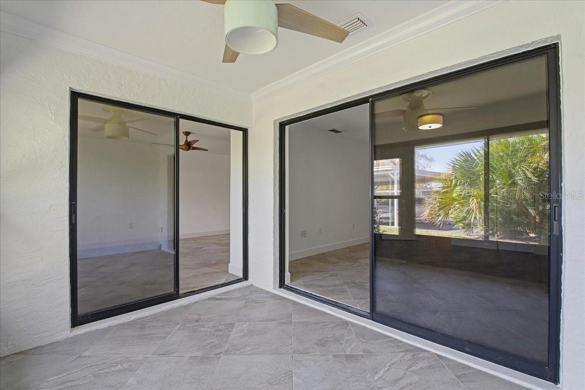 Lanai looking towards living room slider and primary bedroom slider