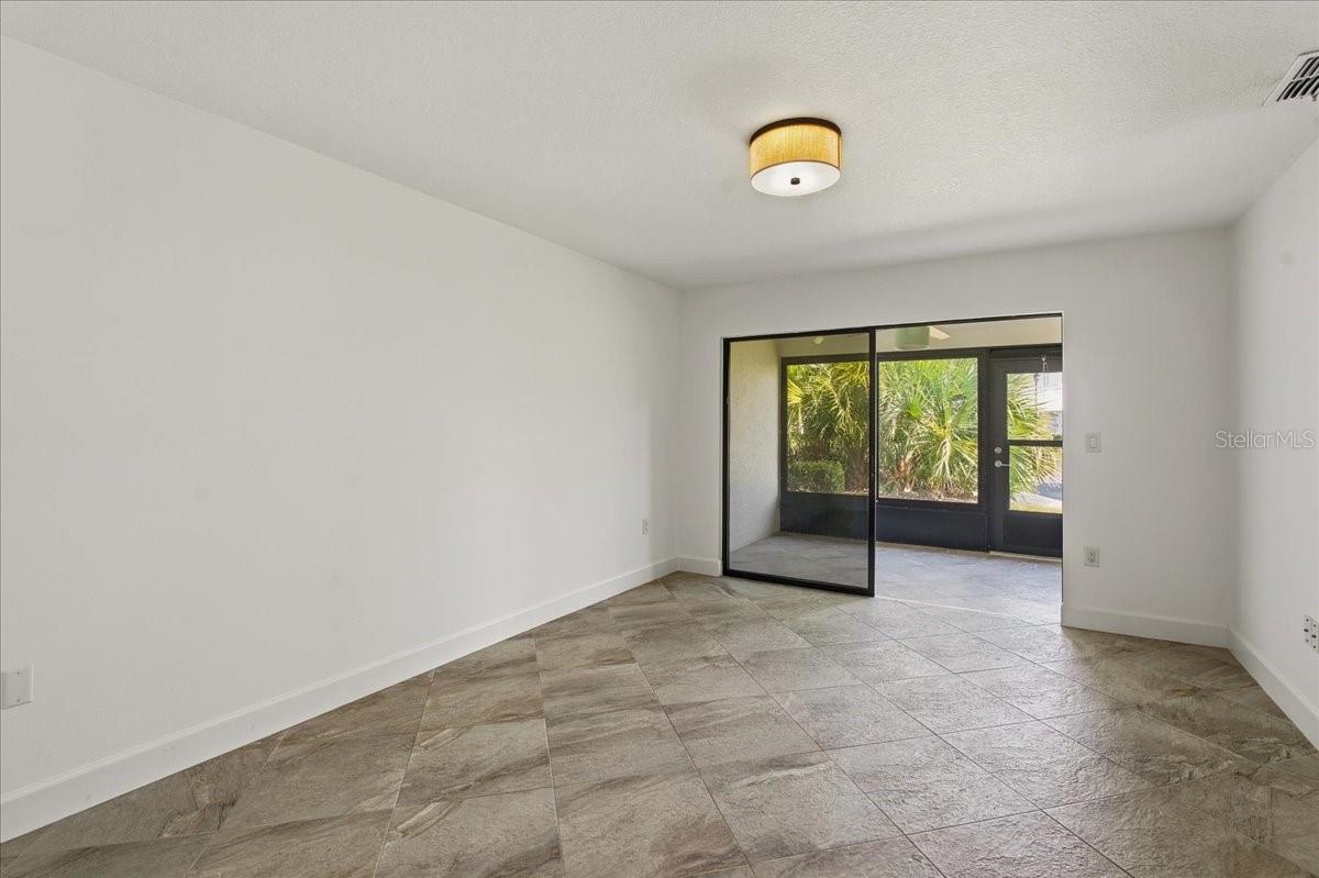 Primary bedroom looking out towards the lanai