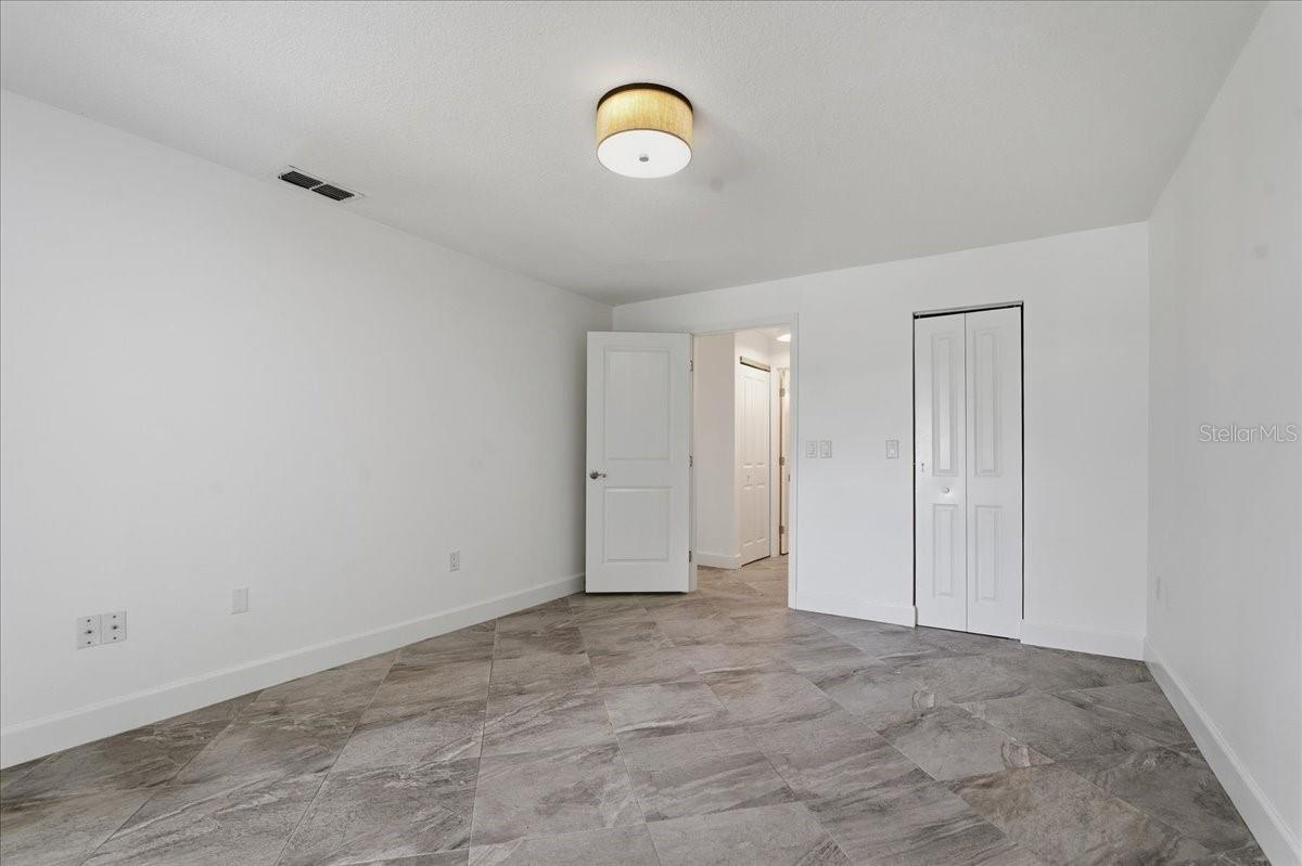 Primary bedroom looking out toward hall